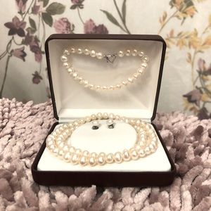 Freshwater pearls set with Sterling Silver heart clasp. Like new condition.